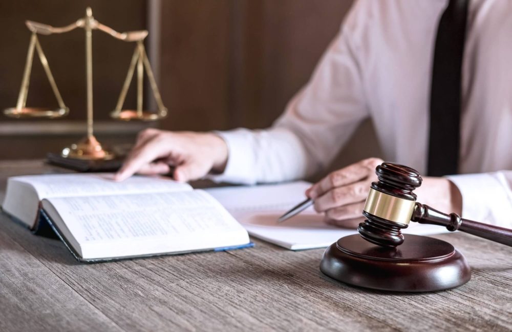 male lawyer or judge working with law books 1.jpg